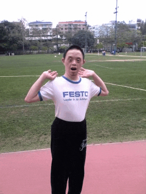 a man with down syndrome wearing a festo t-shirt