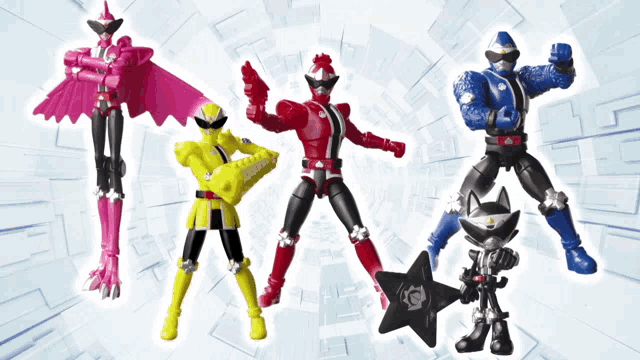 a group of action figures are standing next to each other with one holding a star