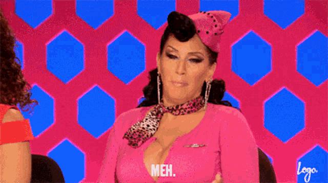 a woman in a pink shirt and leopard print scarf says " meh "
