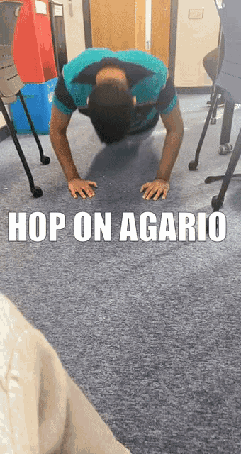a man doing push ups with the words hop on agario behind him