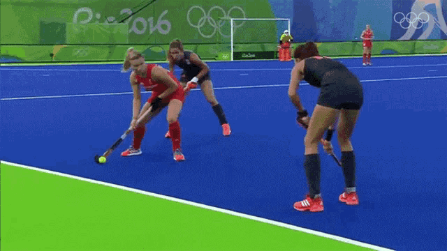 a field hockey game is being played at the rio 2016 olympic games