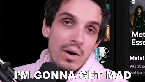 a man talking into a microphone with the words " i 'm gonna get mad " written below him