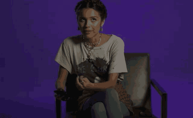 a woman wearing a t-shirt that says the cure
