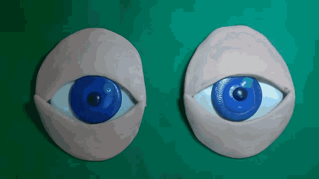 a pair of clay eyes with blue lenses