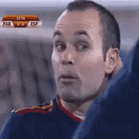 a man is watching a soccer game with esp written on the screen