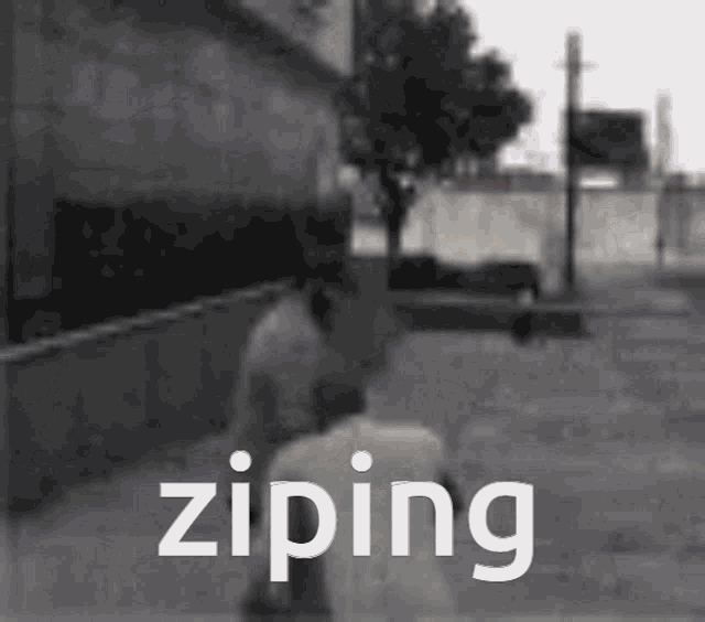 a black and white photo of a person zipping