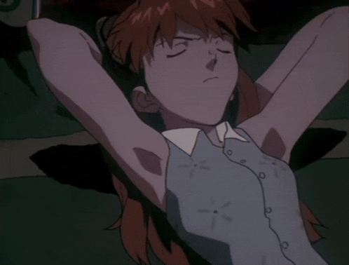 a woman in a white dress is laying on the floor with her eyes closed