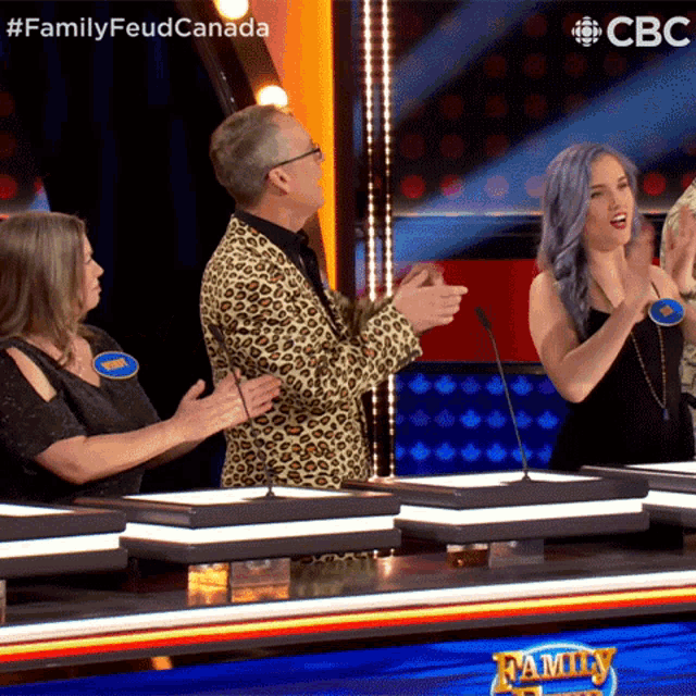 a group of people are playing a game called family feud on cbc