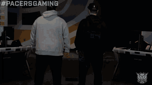 two men wearing pacers hoodies are posing for a picture