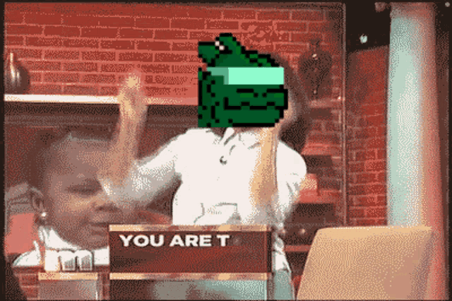 a pixelated image of a man with a green box on his head and the words " you are t "
