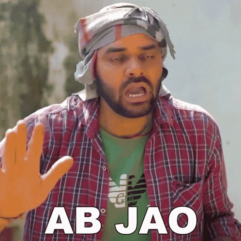 a man wearing a plaid shirt and a green shirt with the word ab jao on it