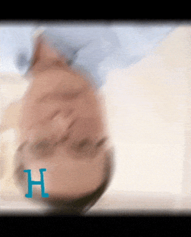 a blurry picture of a person 's face with the letter h visible
