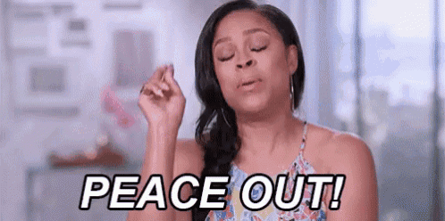 a woman is making a peace sign with her eyes closed and the words peace out .