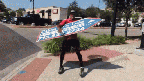 a man in a red shirt is holding a large sign that says cables over oaks specials