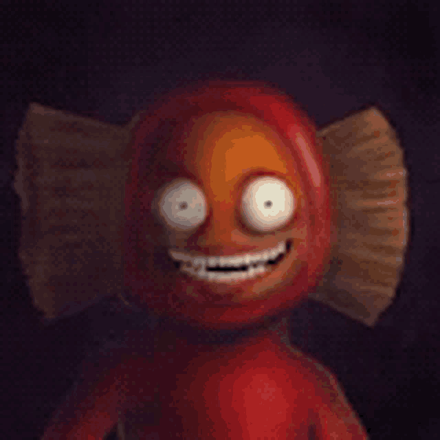 a close up of a cartoon character with big eyes and a big smile on his face .