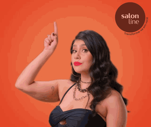 a woman is pointing up in front of a salon line sign