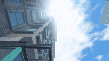 looking up at a very tall building with a blue sky in the background