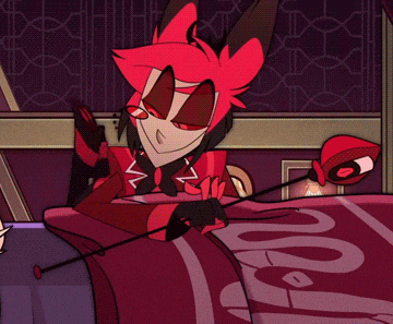a cartoon character is laying on a bed with a snake on it