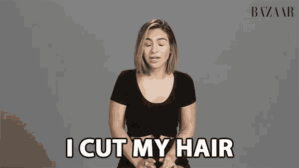 a woman says " i cut my hair " in front of a grey background