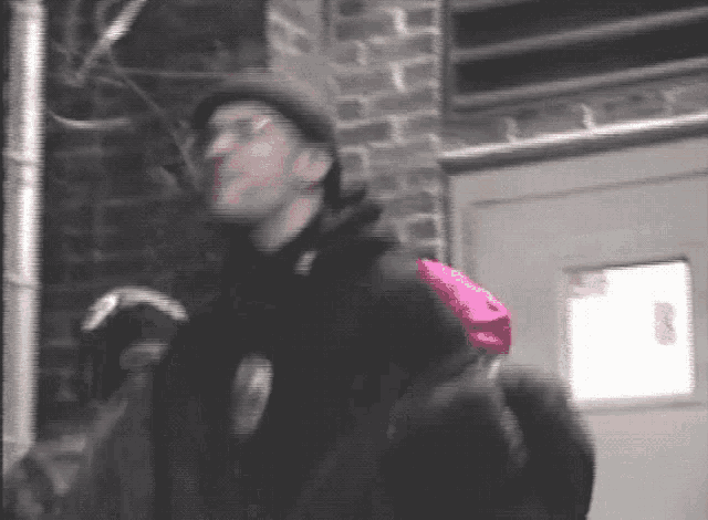 a blurry picture of a man with a backpack