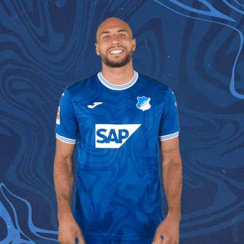 a man wearing a blue shirt that says sap