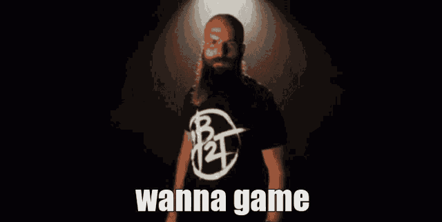 a man with a beard is wearing a shirt that says " wanna game "