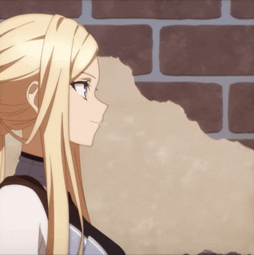 a blonde anime girl is standing in front of a brown brick wall