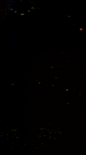 a colorful butterfly is flying through the air in the dark