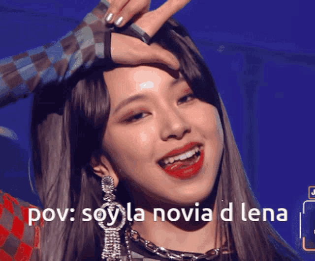 a woman 's face is being touched by another woman with the words pov soy la novia d lena written below her