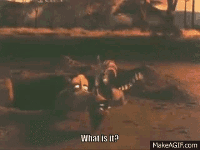 a cartoon character is laying in the dirt and talking about what is it .