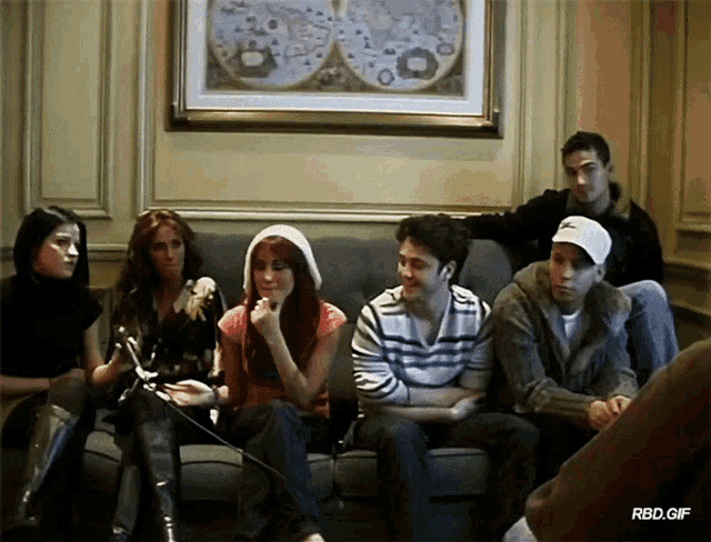 a group of people sitting on a couch with rbd.gif at the bottom of the image