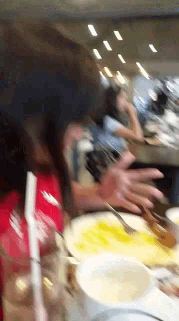 a blurry picture of a person sitting at a table