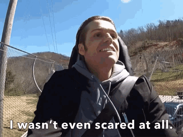 a man riding a roller coaster with the words i wasn 't even scared at all below him