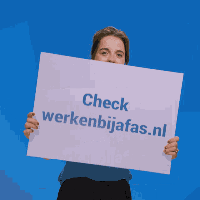 a woman holds up a sign that says check werkenbijjas.nl