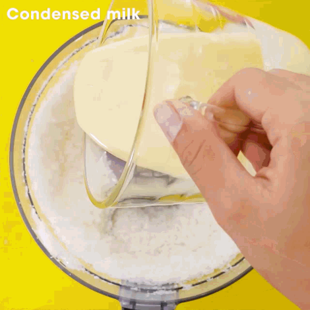 a food processor filled with a white substance that says 6 cups on the bottom