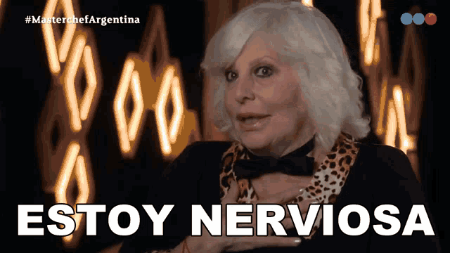 a woman in a leopard print shirt and bow tie says " estoy nerviosa "