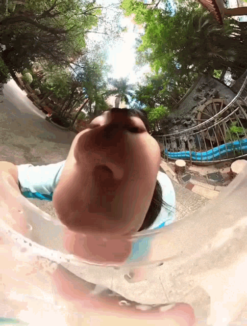 a person is swimming in a pool with their head in the water