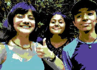 a boy and two girls giving a thumbs up