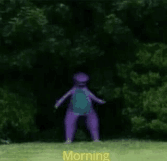 a purple dinosaur is standing in the grass in a field .