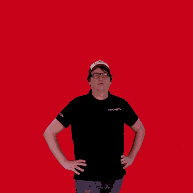 a man with his arms outstretched wearing a black shirt that says safety on the sleeve