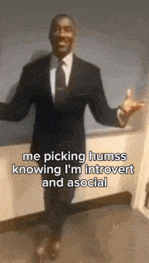 a man in a suit and tie with a caption that says me picking humss knowing i 'm introvert and social