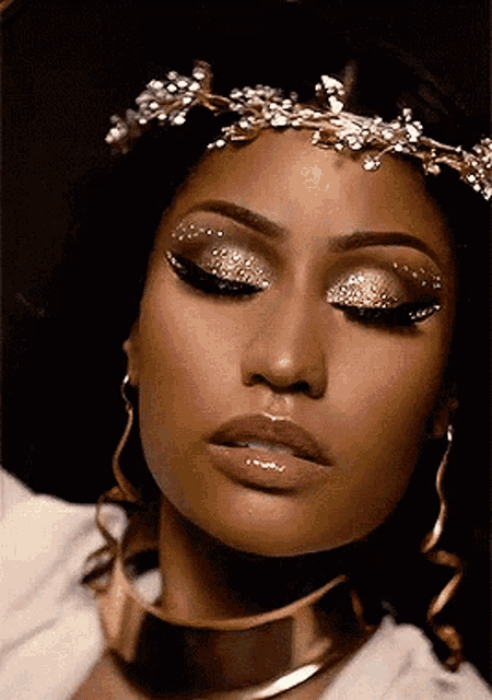 a close up of a woman wearing a choker and a tiara