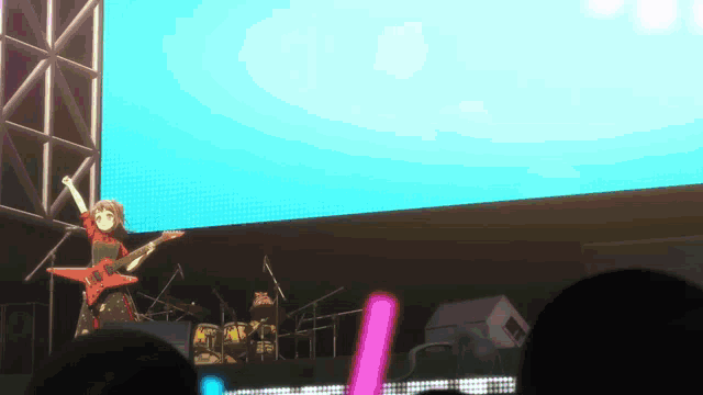 a girl is playing a guitar in front of a crowd