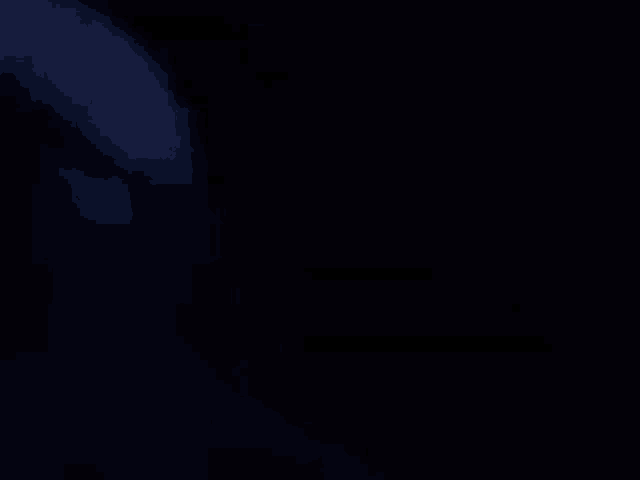 a dark blue background with a few white spots on it .