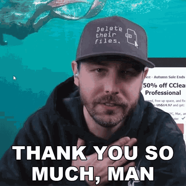 a man is wearing a hat that says delete their files