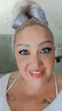 a woman with a tattoo on her chest that says " i love you "
