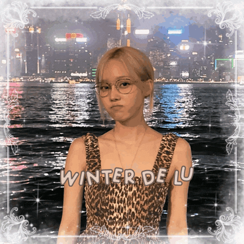 a woman in a leopard print dress with the words winter de lu written on the bottom