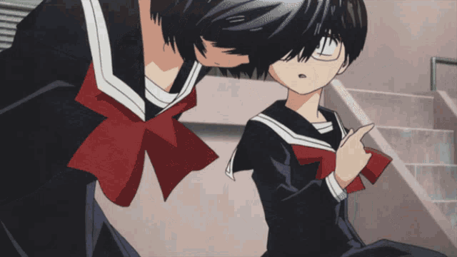 a girl with glasses and a red bow is pointing at another girl
