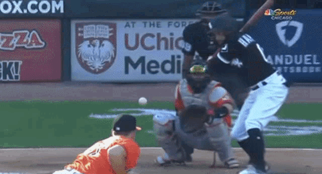 a baseball game is being played in front of a sign that says ox.com