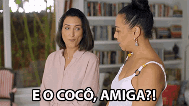 two women standing next to each other with eo coco amiga